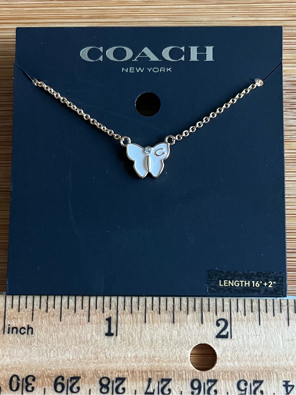Coach Signature Butterfly Necklace Gold Tone White Enamel w/ a Crystal Accent
